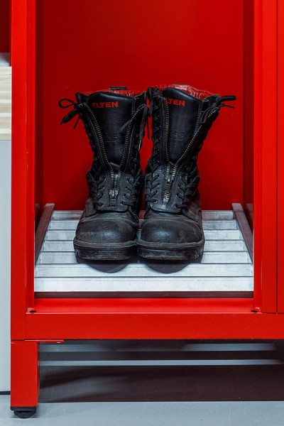 lockeel® Galvanised boot rack with duty boots in fire brigade locker